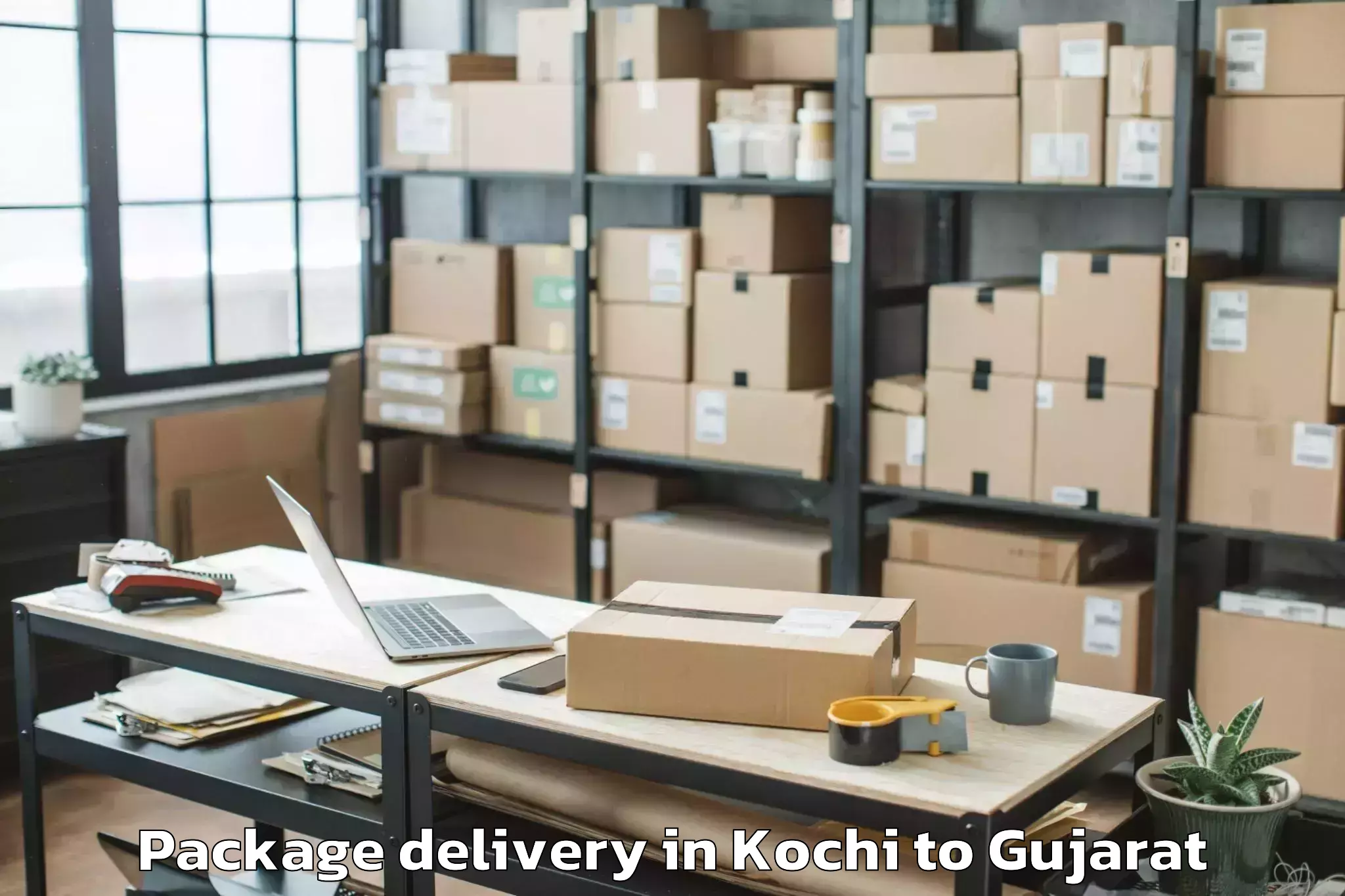 Kochi to Gujarat University Of Transpla Package Delivery Booking